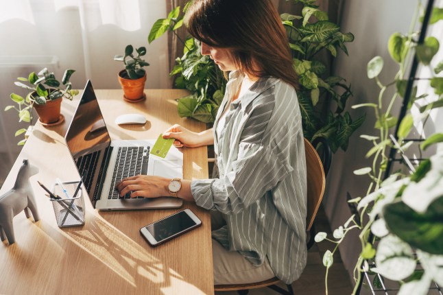 Woman checking her free credit report on a laptop